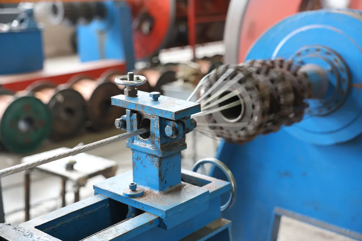 Cage-type stranding machine compacting individual copper wires into a Class 2 stranded conductor for medium voltage cable