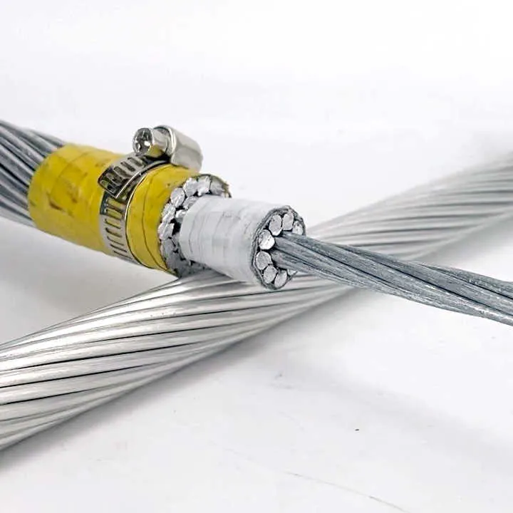 High-voltage transmission tower with ACSR conductors in open terrain
