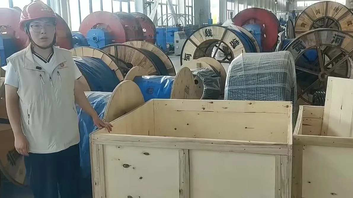 Finished medium voltage cable on timber drums in a factory warehouse, prepared for export packing and pre-shipment inspection